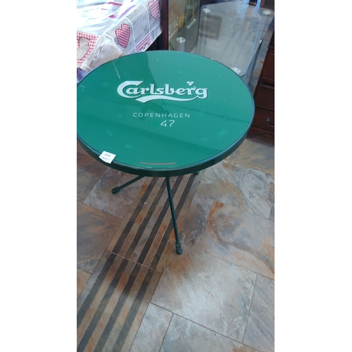 314 - Promotional Carlsberg table features a green glass top with logo and 