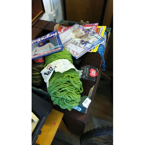 323 - Mixed lot including knitting magazines, various skeins of yarn, and needlecraft guides. Brands inclu... 