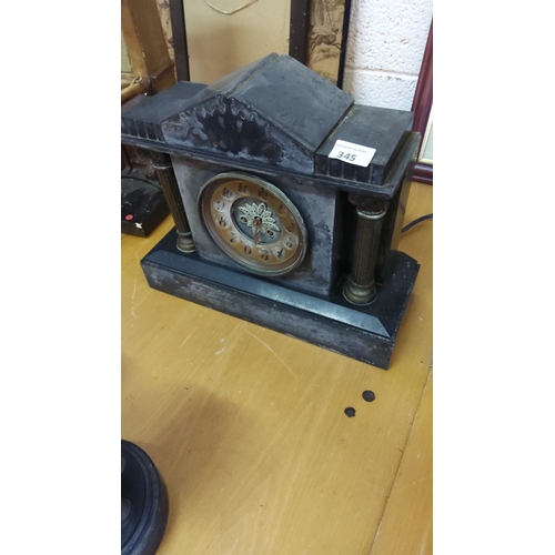 345 - Antique slate mantel clock with Roman numeral dial, featuring classical architectural details.From t... 