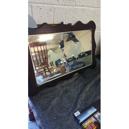 352 - Vintage wall mirror with etched horse and carriage design and a scalloped dark wood frame.