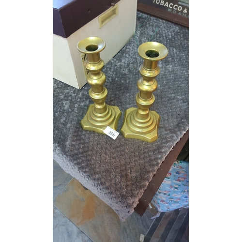 356 - Pair of vintage brass candlesticks with a stepped base design.