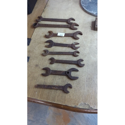 392 - Set of eight vintage metal wrenches in varying sizes, characterized by a rustic patina, indicative o... 