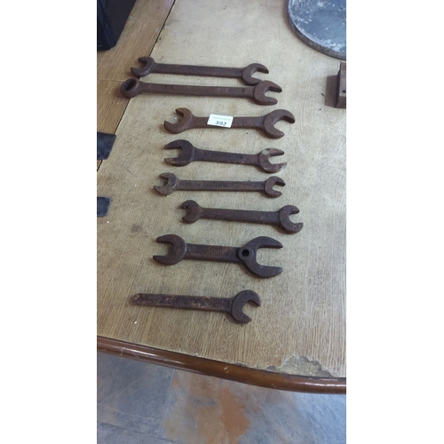 392 - Set of eight vintage metal wrenches in varying sizes, characterized by a rustic patina, indicative o... 