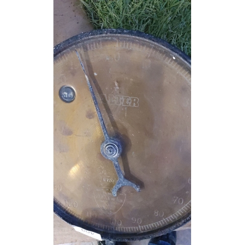 409 - Vintage Salter hanging scale with an iron body and a brass faceplate. Measures up to 200 lbs. Made i... 