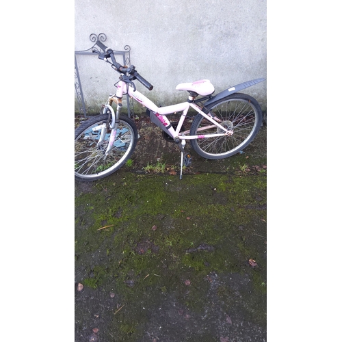 440 - Children's pink bicycle with decorative accents, featuring a sturdy frame and functional tires.(need... 