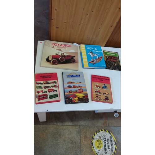 449 - Collection of seven books on toy vehicles and games, including 