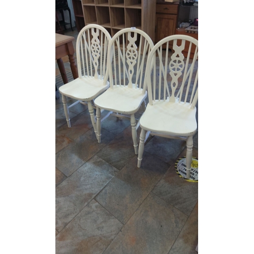 451 - Set of three painted wooden dining chairs with decorative spindle back design.