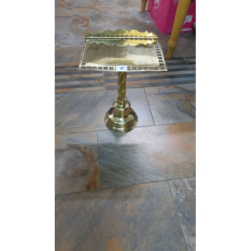 47 - Victorian-style brass church bookstand featuring ornate detailing.