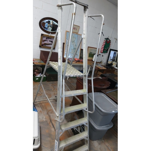 470 - Industrial aluminum platform ladder with handrails and steps.