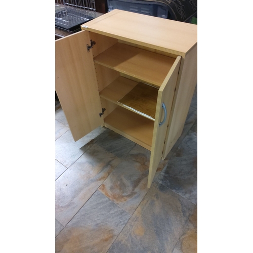 473 - Wooden storage cabinet with two doors, interior shelving, and silver handles.