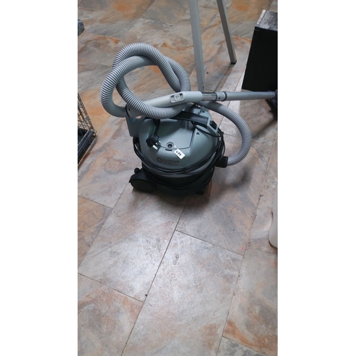 479 - Nilfisk VP300 HEPA vacuum cleaner features a durable design and efficient HEPA filtration system. It... 