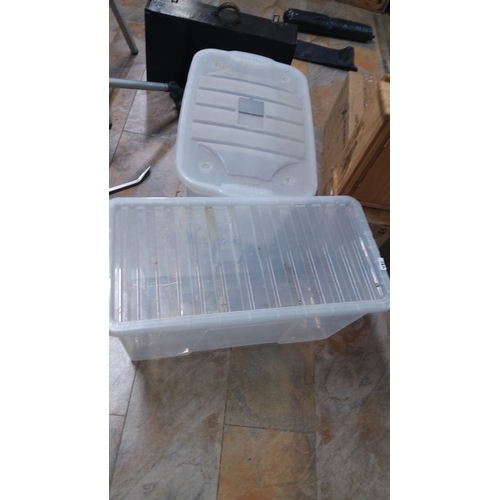 481 - Two clear plastic storage bins with lids Ideal for organizing and protecting various items.