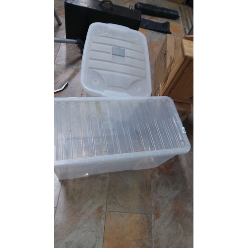 481 - Two clear plastic storage bins with lids Ideal for organizing and protecting various items.