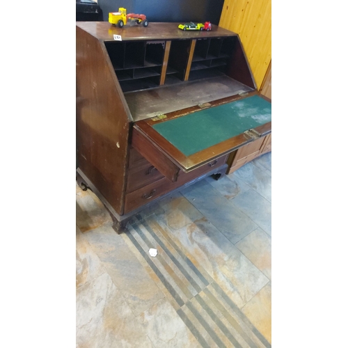 483 - Antique mahogany drop-front bureau, featuring multiple drawers and internal compartments, from the V... 