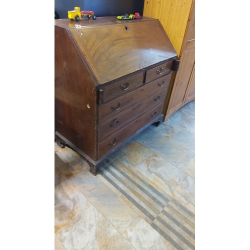 483 - Antique mahogany drop-front bureau, featuring multiple drawers and internal compartments, from the V... 