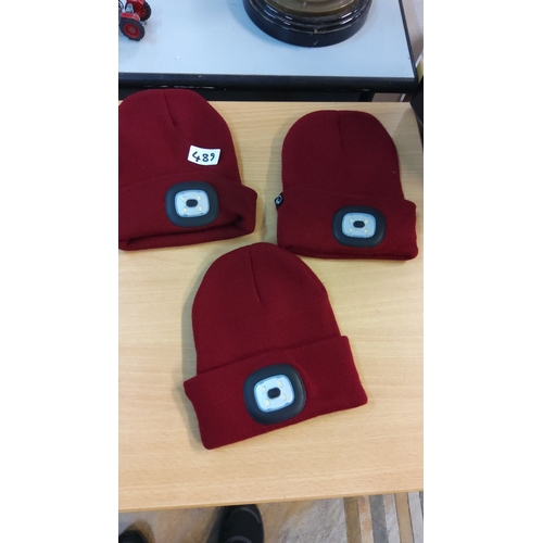 489 - Set of three red knit beanies featuring integrated LED lights.