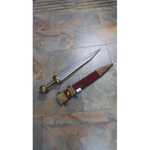 53 - Romano-British replica gladius with scabbard, enhanced with brass detailing and red leather. Exempli... 