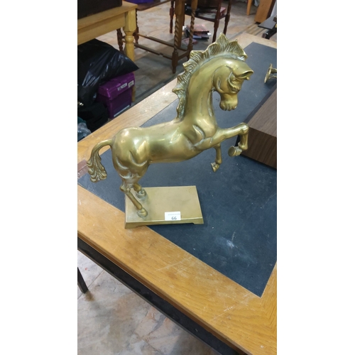 66 - Vintage brass rearing horse sculpture with dynamic form and elegant detailing.