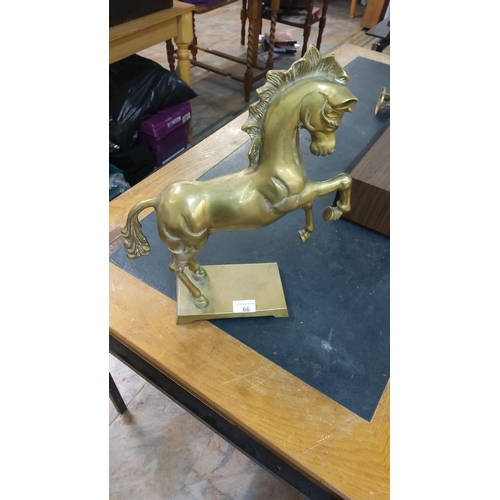 66 - Vintage brass rearing horse sculpture with dynamic form and elegant detailing.