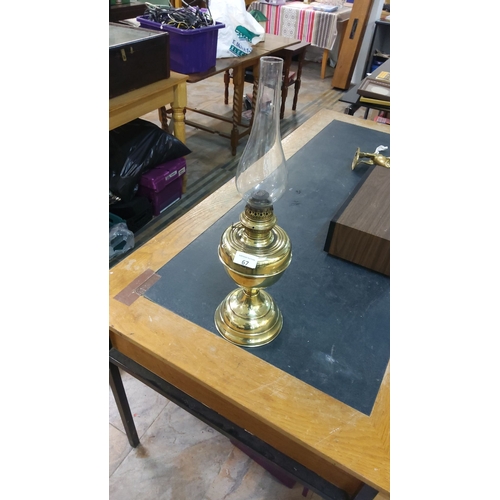 67 - Brass Victorian-style oil lamp with an ornate chimney in excellent condition.