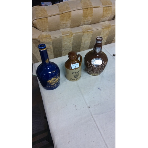 8 - Selection of decorative spirit bottles, featuring Courvoisier cognac decanter, Royal Doulton-style j... 