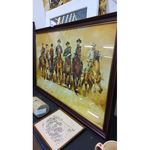 85 - Framed Magnificent 7 Western art, depicting the iconic cowboys on horseback.