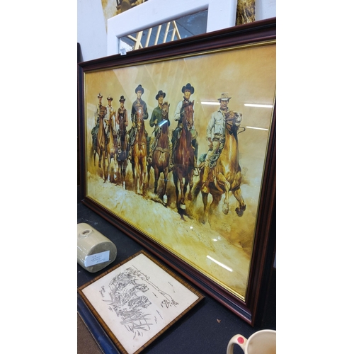 85 - Framed Magnificent 7 Western art, depicting the iconic cowboys on horseback.