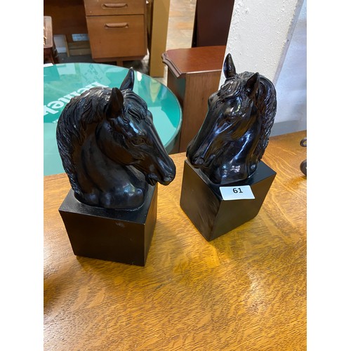 61 - Pair of vintage equestrian busts crafted in dark resin.