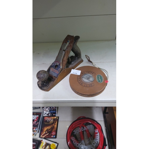 134 - Vintage Stanley hand plane with wood knob, accompanied by leather-cased measuring tape