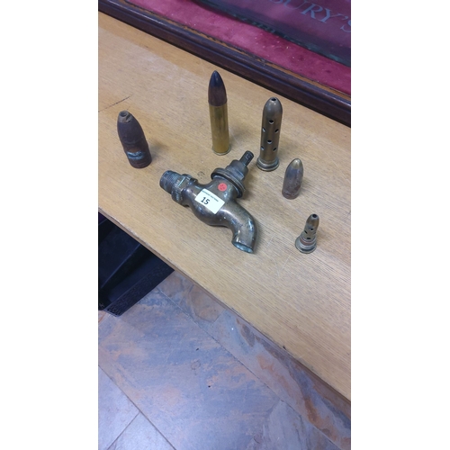 15 - Mixed lot featuring vintage brass faucet tap, various inert artillery shells, and bullet casings.