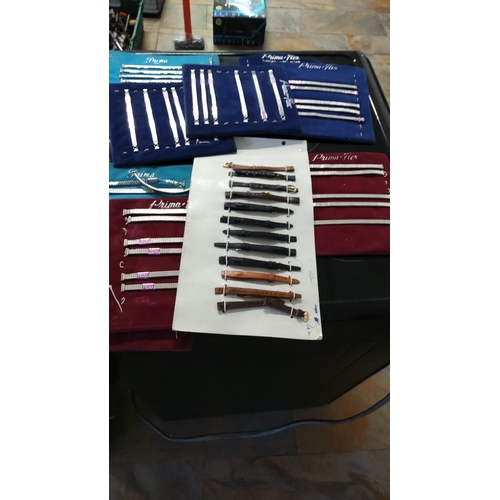 151 - Collection of assorted vintage watch bands, including metal expansion and leather options, presented... 