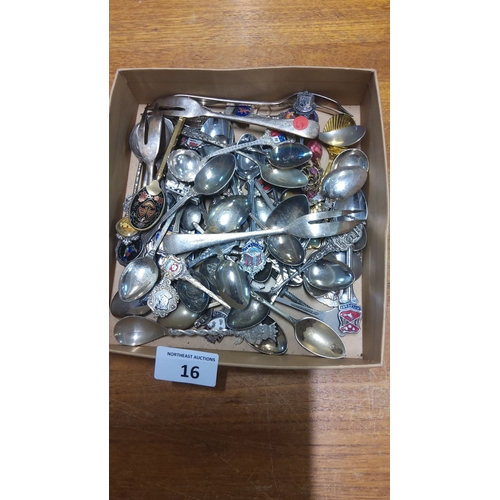 16 - Assorted vintage souvenir teaspoons, silver-plated with enamel crests, collectible designs, and orna... 