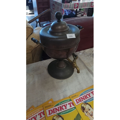 164 - Vintage brass samovar with ornate spigot, wooden handles, and classic pedestal base.