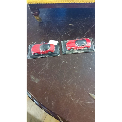 179 - Set of two collectible Dodge Viper SRT-10 die-cast models, mint in original packaging. Features vibr... 