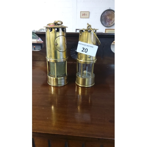 20 - Pair of vintage brass miner’s lamps, mid-20th century. They feature a functional design with glass p... 