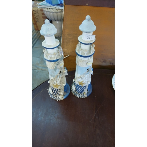 217 - Set of Two Nautical Lighthouse Figurines, Coastal Decor. Painted wood with rope, seashell, and starf... 