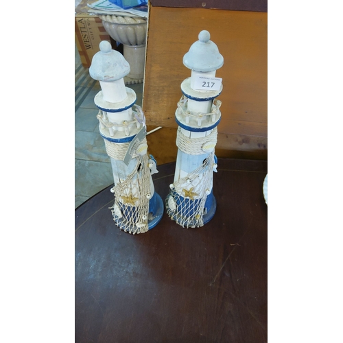 217 - Set of Two Nautical Lighthouse Figurines, Coastal Decor. Painted wood with rope, seashell, and starf... 