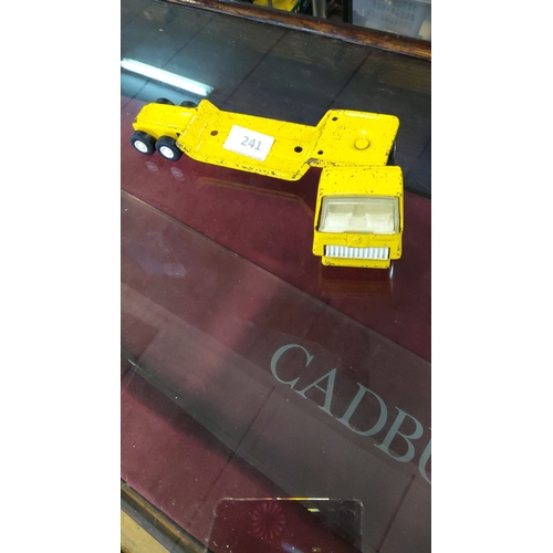 241 - Vintage yellow die-cast Tonka toy truck cab and chassis. Features four rear wheels, detailed cab des... 