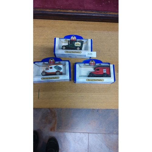 245 - Set of 3 die-cast metal replica vehicles by Oxford, featuring vintage delivery trucks with advertisi... 