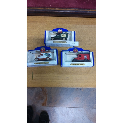 245 - Set of 3 die-cast metal replica vehicles by Oxford, featuring vintage delivery trucks with advertisi... 