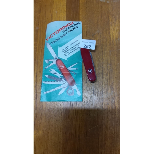 262 - Victorinox Swiss Army Knife with Original Pamphlet features a classic red design and multifunctional... 