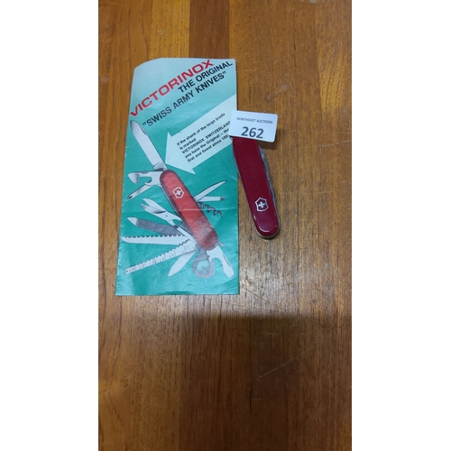 262 - Victorinox Swiss Army Knife with Original Pamphlet features a classic red design and multifunctional... 