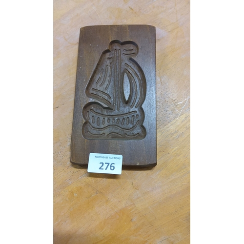 276 - Carved wooden butter mold featuring a ship motif, from the mid-20th century. Excellent patina.