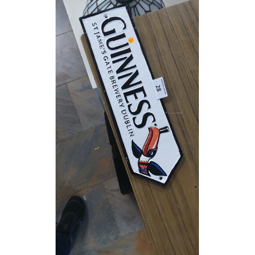 28 - Vintage Guinness cast iron sign featuring iconic toucan design and 