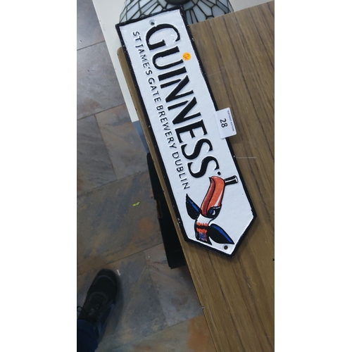 28 - Vintage Guinness cast iron sign featuring iconic toucan design and 