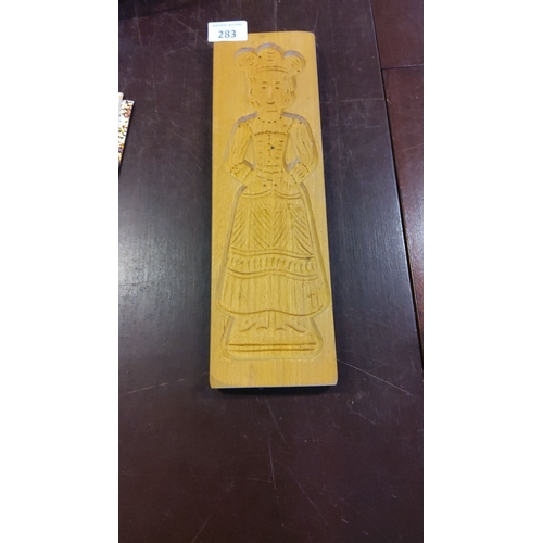 283 - Wooden cookie mold, early 20th century, carved figure of a woman in traditional dress.