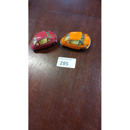 285 - Pair of Corgi Toys diecast Isetta bubble cars, circa 1950s/60s. Vibrant red and orange models, origi... 