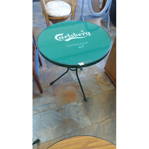 296 - Vintage Carlsberg Copenhagen 47 Bistro Table. Bold green metal with branded glass top, three-legged ... 