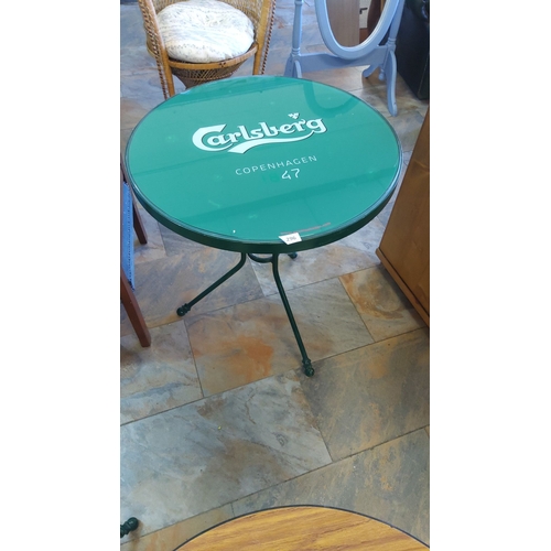 296 - Vintage Carlsberg Copenhagen 47 Bistro Table. Bold green metal with branded glass top, three-legged ... 