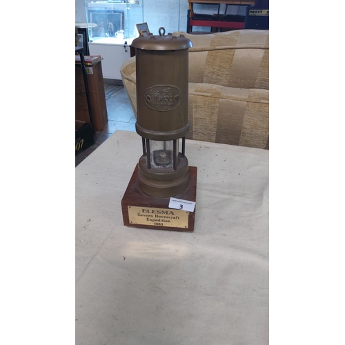 3 - Brass miners safety lamp on wood base, commemorates the 1983 BLESMA Severn Hovercraft Expedition. Fe... 